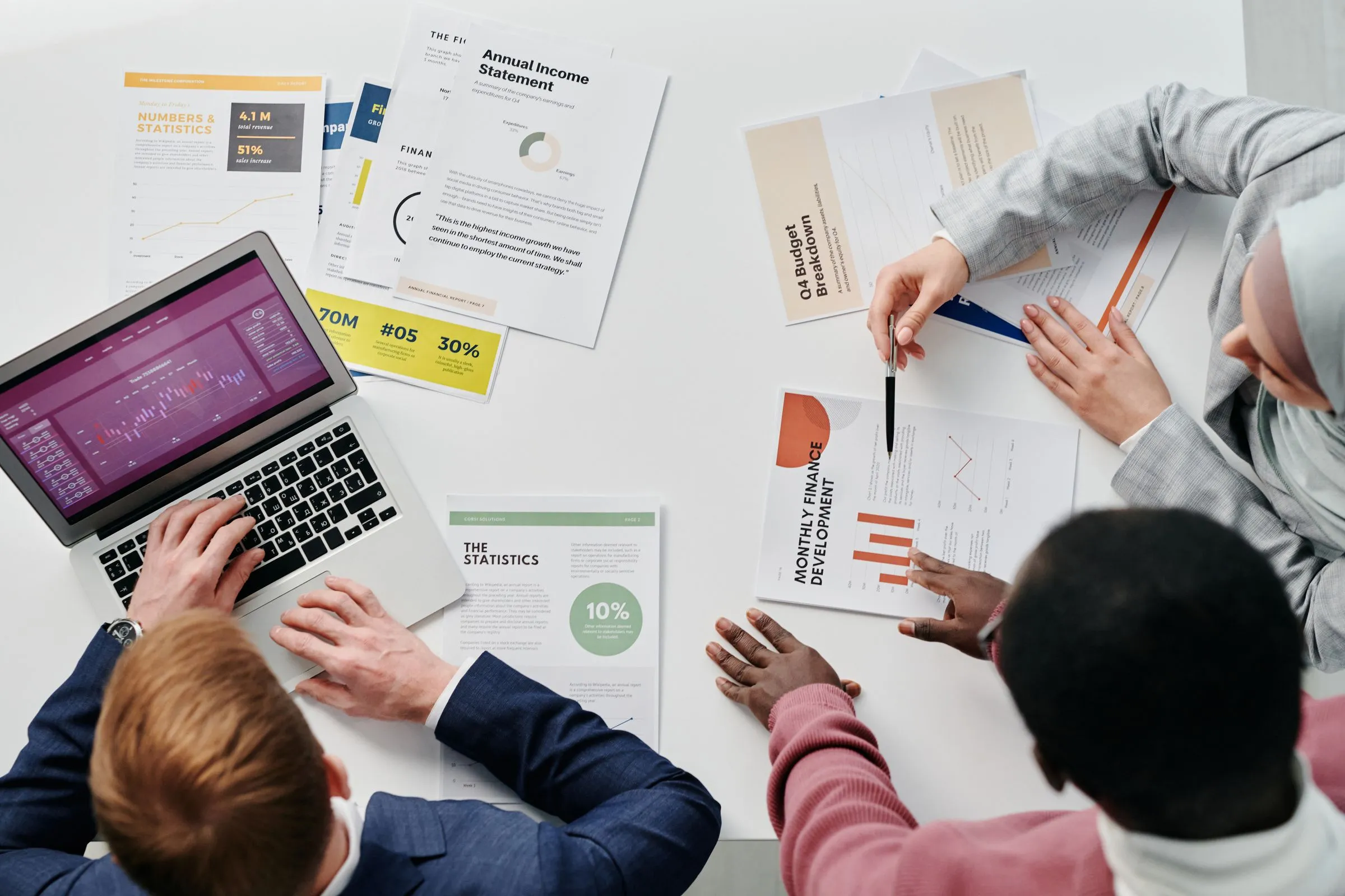 A team reviewing financial reports around a table